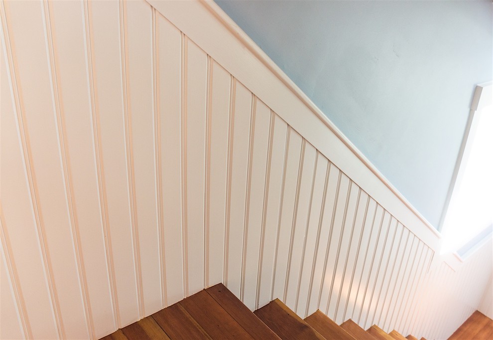 Example of a mid-sized cottage wooden l-shaped wood railing staircase design in Boston with wooden risers