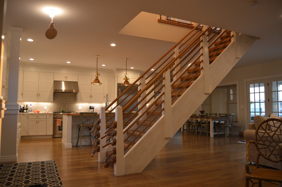 Staircase - coastal wooden floating open staircase idea in New York
