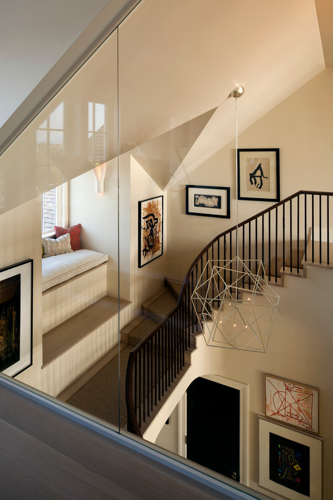Example of a transitional wooden u-shaped staircase design in Jacksonville with wooden risers