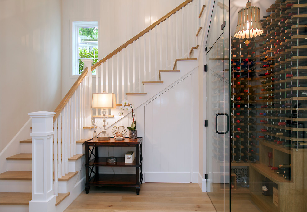 Classic staircase in Orange County with feature lighting.