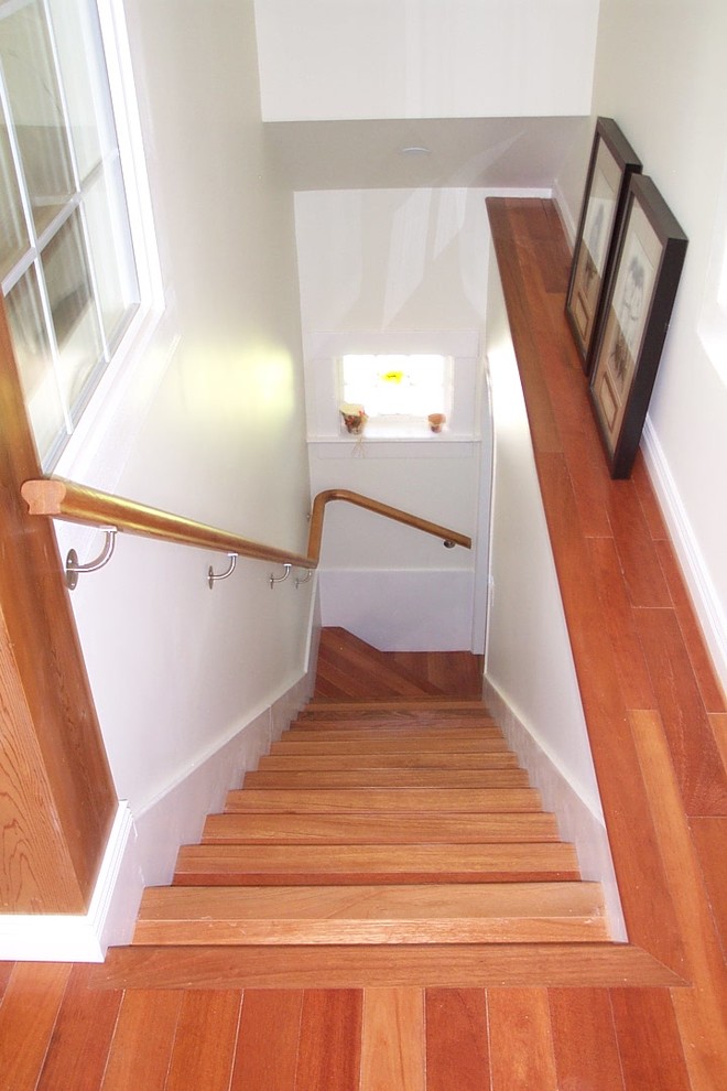 This is an example of a traditional wood staircase in Vancouver with wood risers.