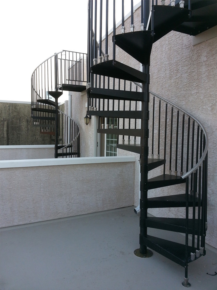 Mid-sized elegant metal spiral open staircase photo in Philadelphia