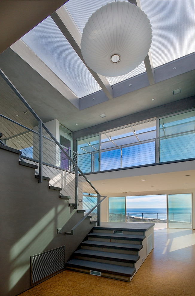 Example of a trendy u-shaped metal railing staircase design in Los Angeles