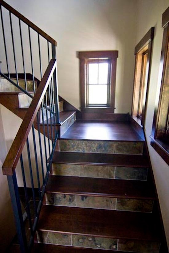 Photo of a large tiled l-shaped staircase in Denver.