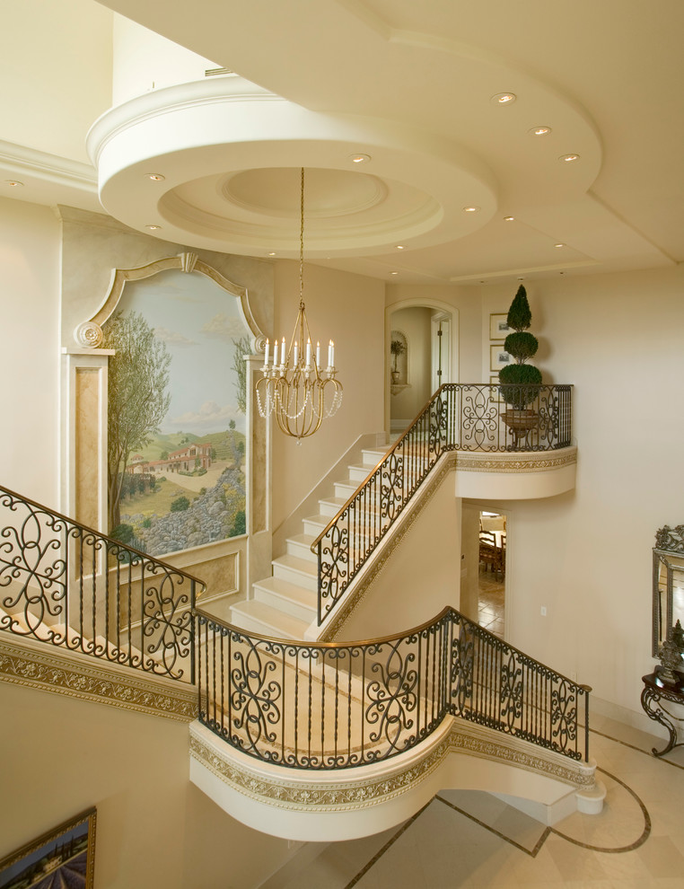 Photo of an expansive traditional curved staircase in San Francisco.