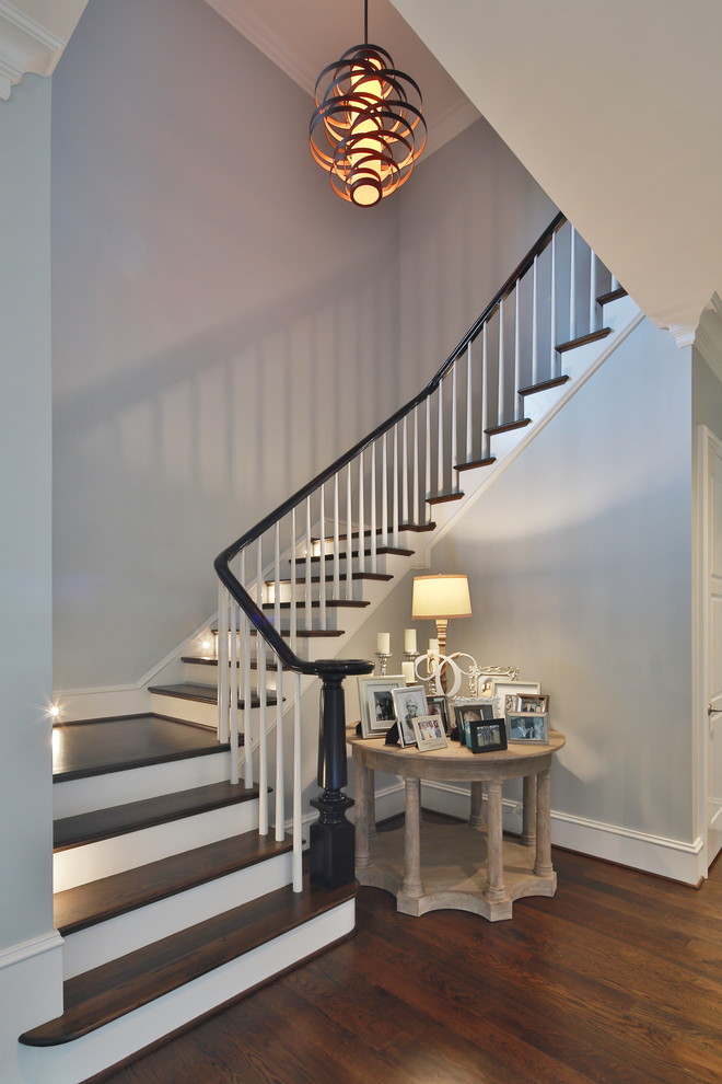 Transitional wooden l-shaped staircase photo in Raleigh with painted risers