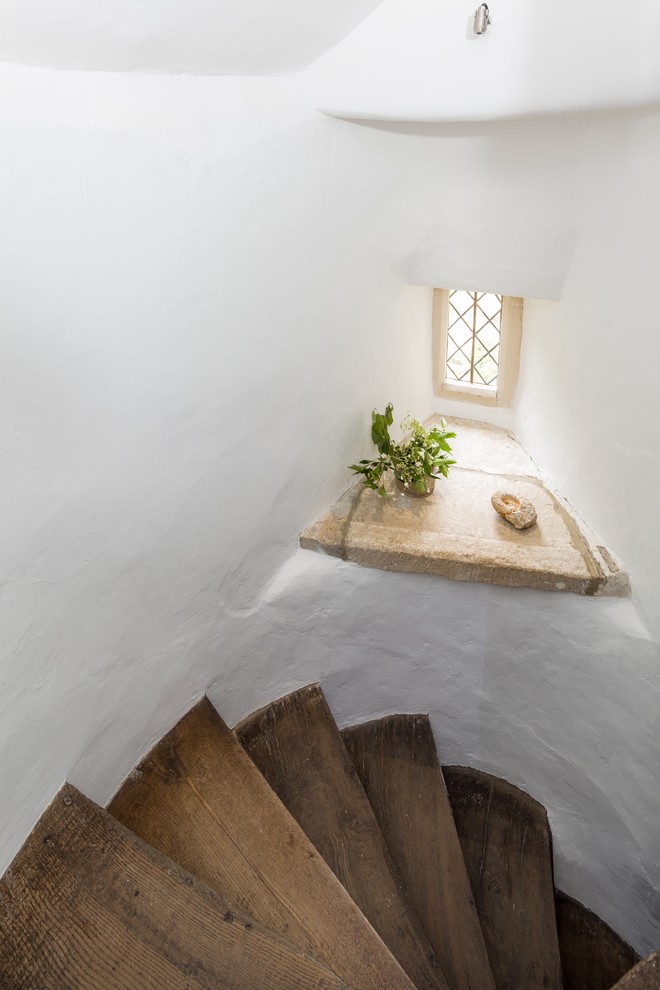 Inspiration for a contemporary wooden staircase remodel in Gloucestershire with wooden risers