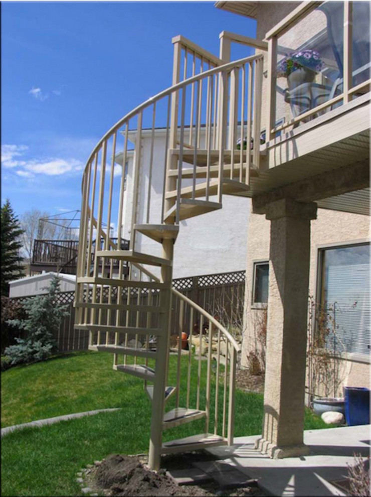 Photo of a medium sized traditional spiral staircase in Calgary.