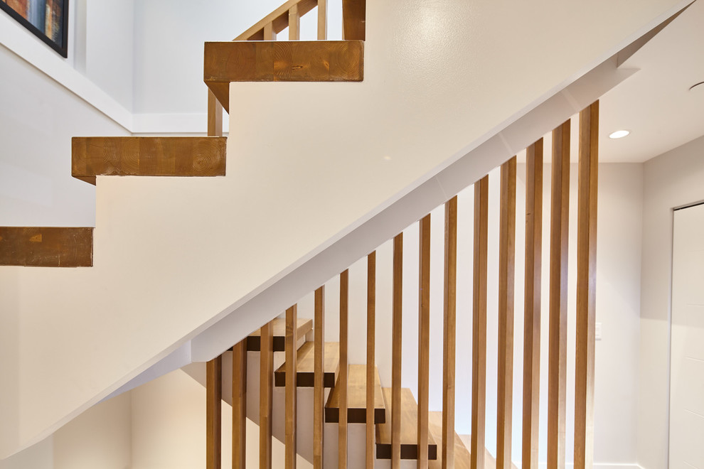 Design ideas for a medium sized contemporary wood straight staircase in Vancouver.