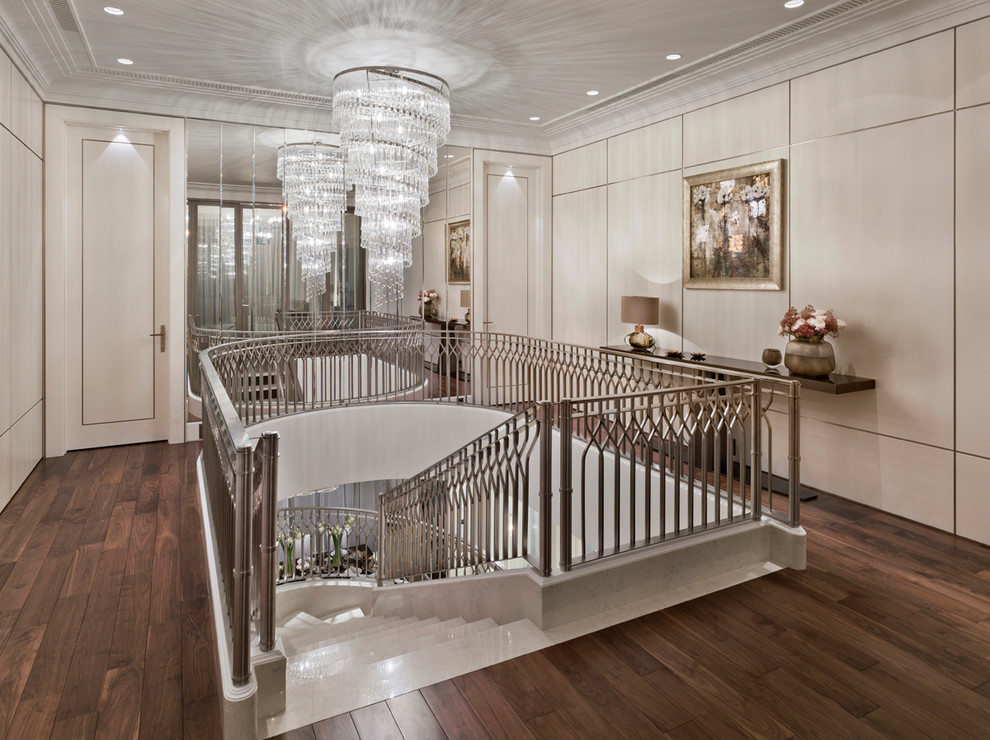 Inspiration for a transitional curved metal railing staircase remodel in Moscow
