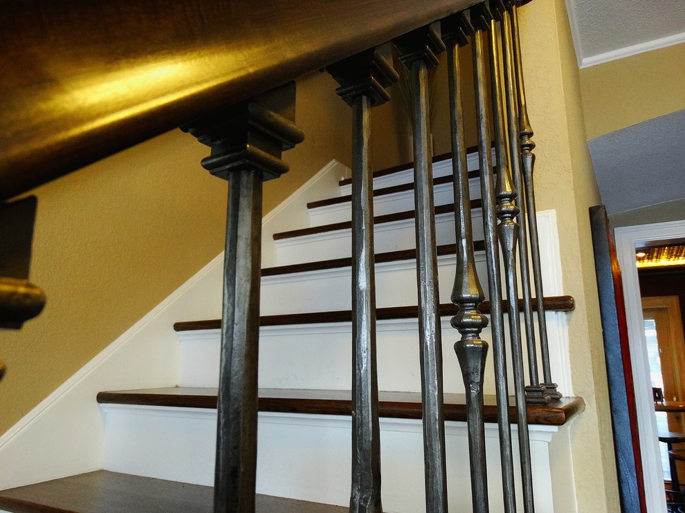 Staircase - mid-sized traditional wooden straight staircase idea in Milwaukee with painted risers