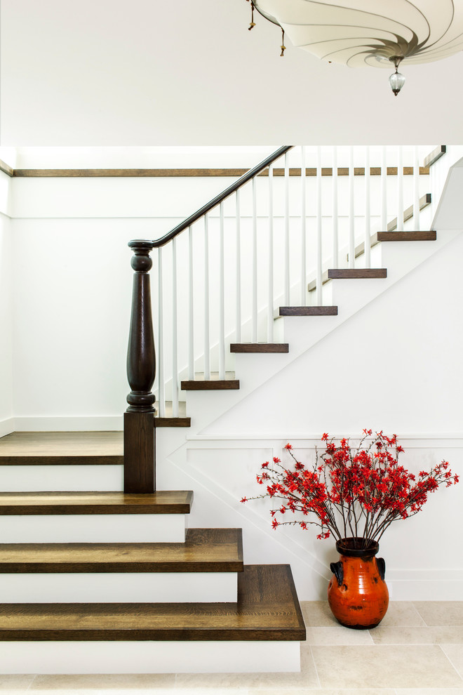 Staircase - eclectic wooden curved staircase idea in Boston