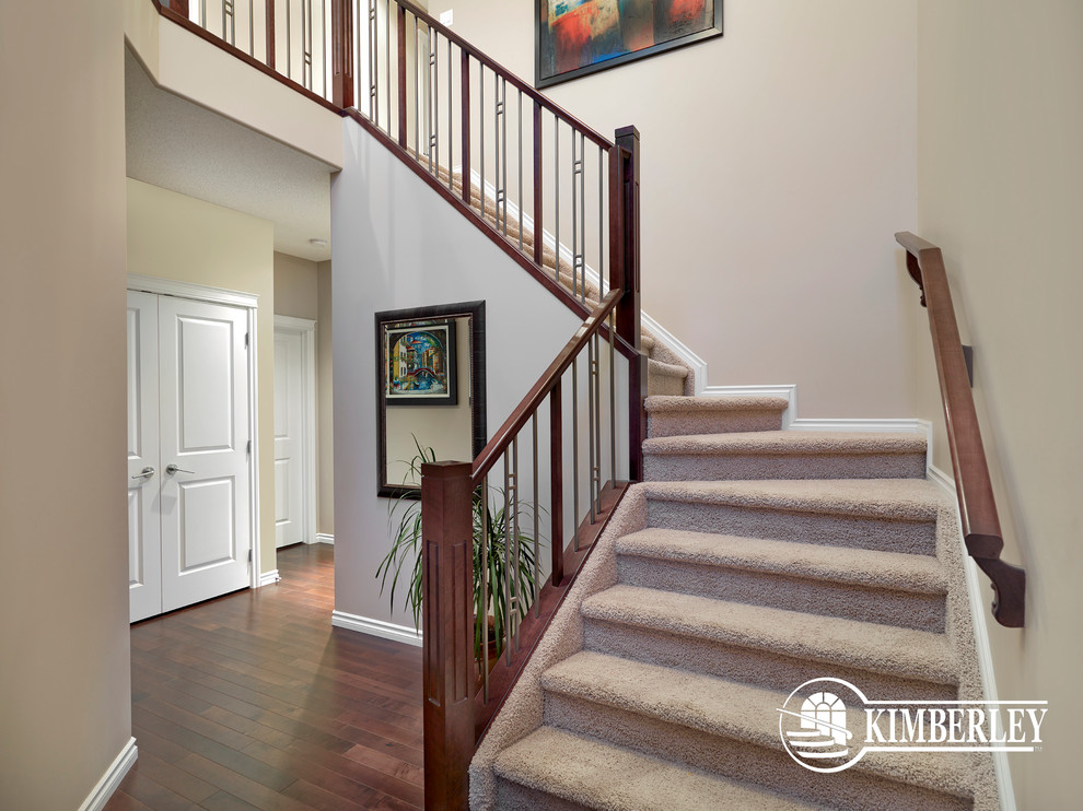 Medium sized traditional carpeted l-shaped staircase in Edmonton with carpeted risers.