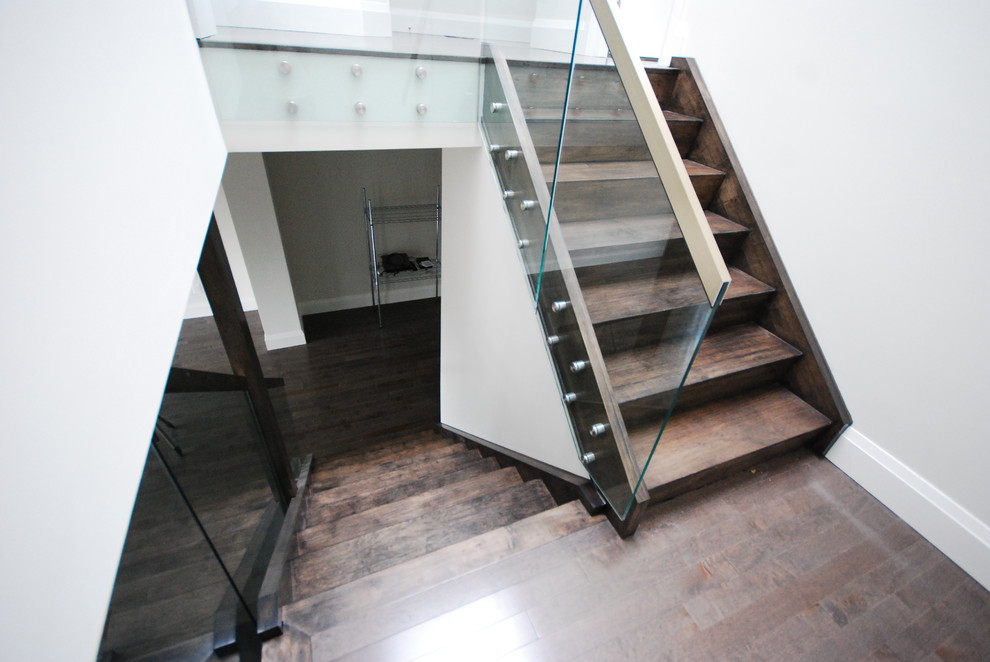 Inspiration for a mid-sized contemporary wooden straight staircase remodel in Toronto with wooden risers