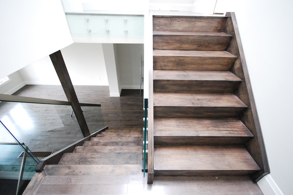 Design ideas for a medium sized contemporary wood straight staircase in Toronto with wood risers.