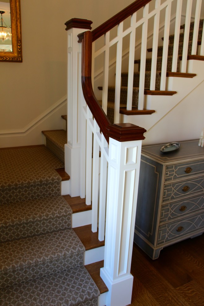 Mid-sized arts and crafts carpeted l-shaped wood railing staircase photo in Boston with carpeted risers