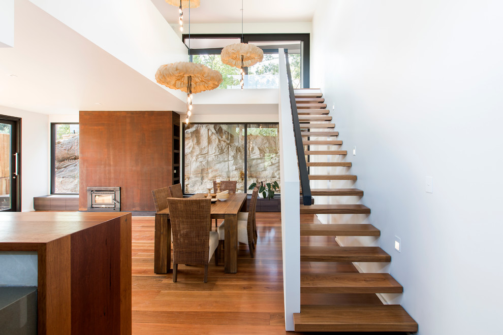 Inspiration for a large contemporary wooden straight open and metal railing staircase remodel in Sydney