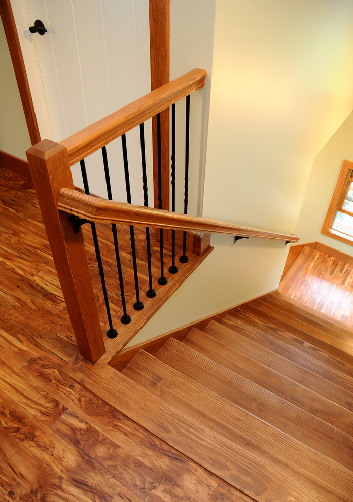 Medium sized classic wood l-shaped staircase in Other with wood risers.