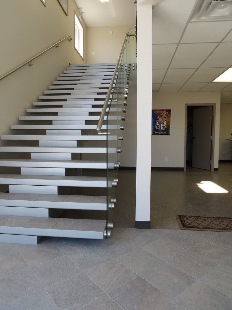 Design ideas for a medium sized contemporary tiled straight glass railing staircase in Other with open risers.