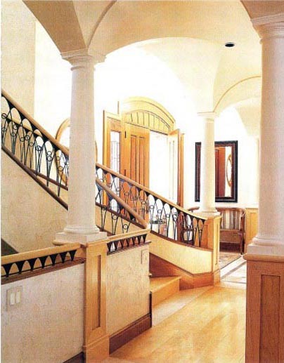 Tuscan wooden curved staircase photo in Denver with wooden risers