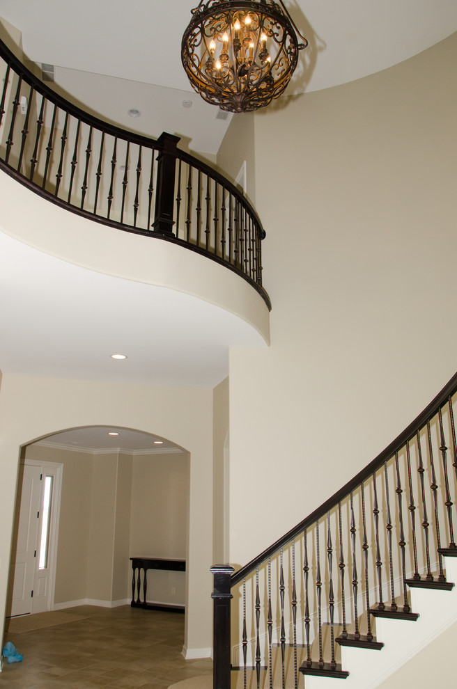 Design ideas for a classic curved staircase in Omaha.
