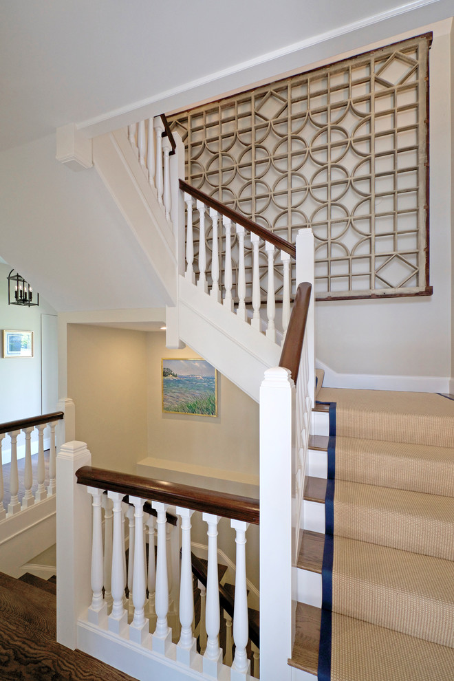 Example of a small beach style wooden l-shaped wood railing staircase design in Boston with wooden risers