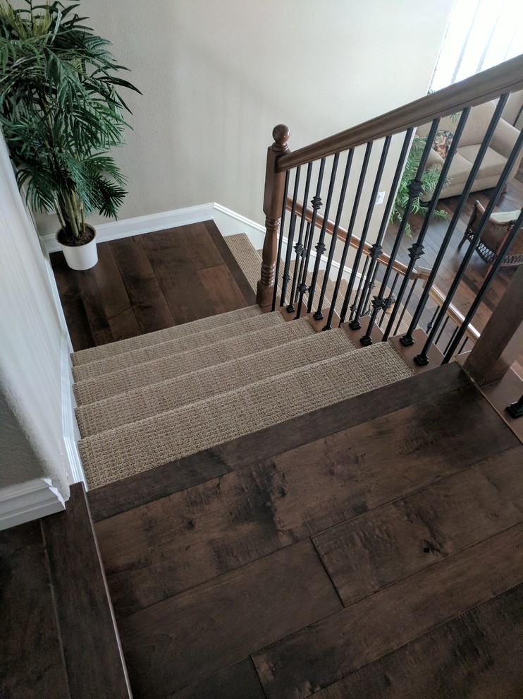 Mid-sized transitional carpeted l-shaped wood railing staircase photo in Los Angeles with wooden risers