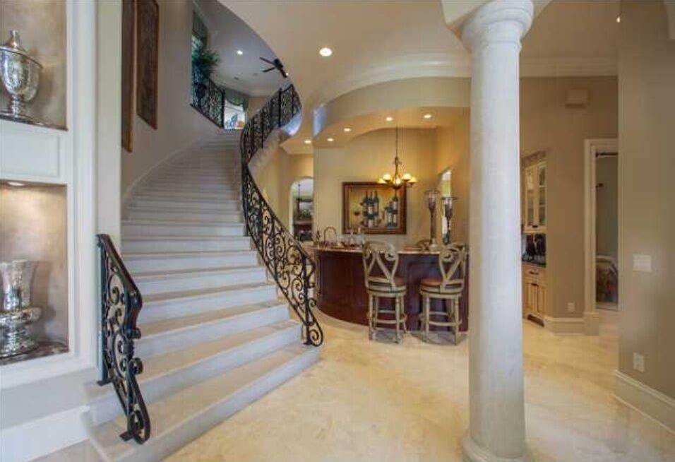 Staircase - mid-sized traditional concrete curved metal railing staircase idea in Atlanta with concrete risers