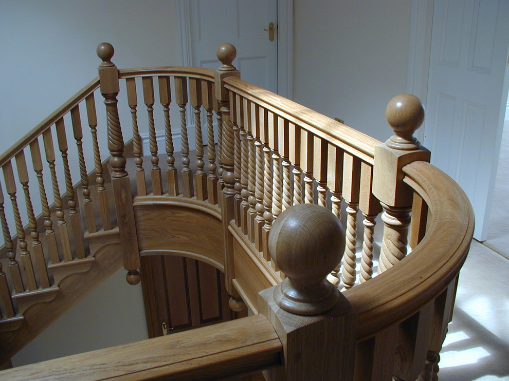 Design ideas for an expansive traditional wood straight staircase in London with wood risers.