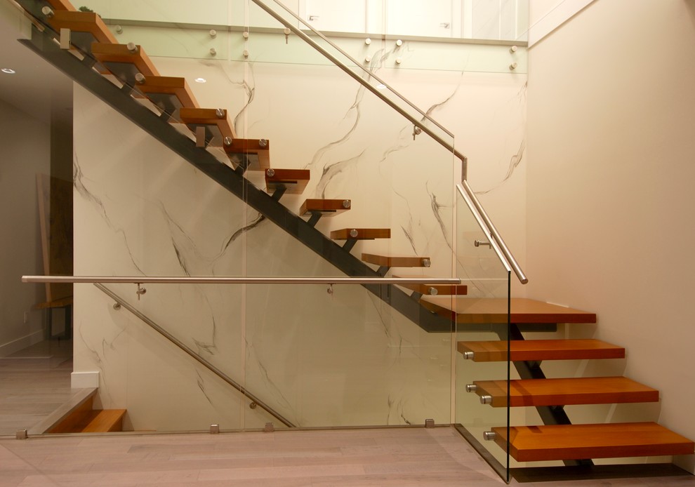 Diseño de escalera en L contemporánea grande sin contrahuella con escalones de madera