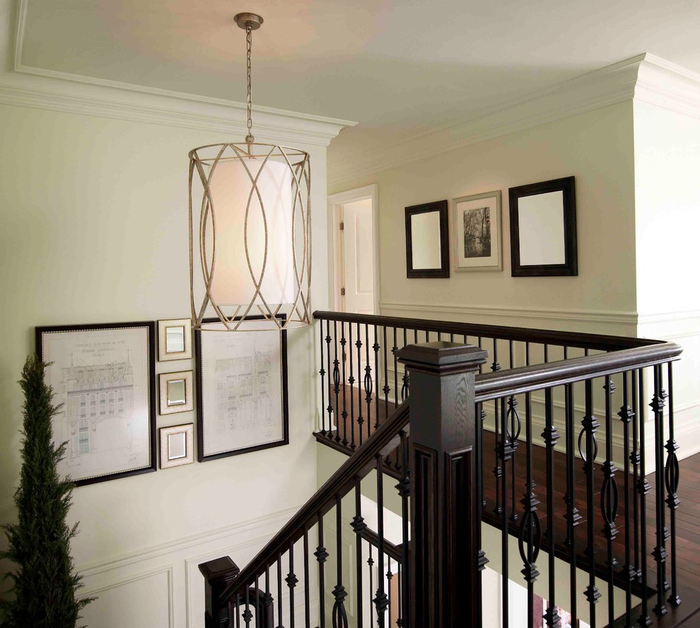 Inspiration for a mid-sized timeless wooden u-shaped staircase remodel in Toronto with painted risers