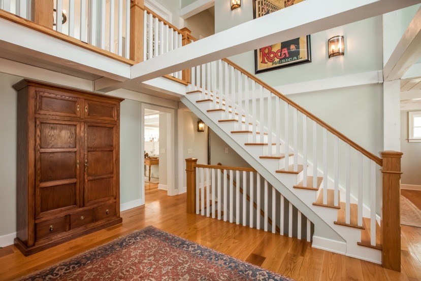 Example of a mid-sized classic wooden straight wood railing staircase design in Bridgeport with painted risers