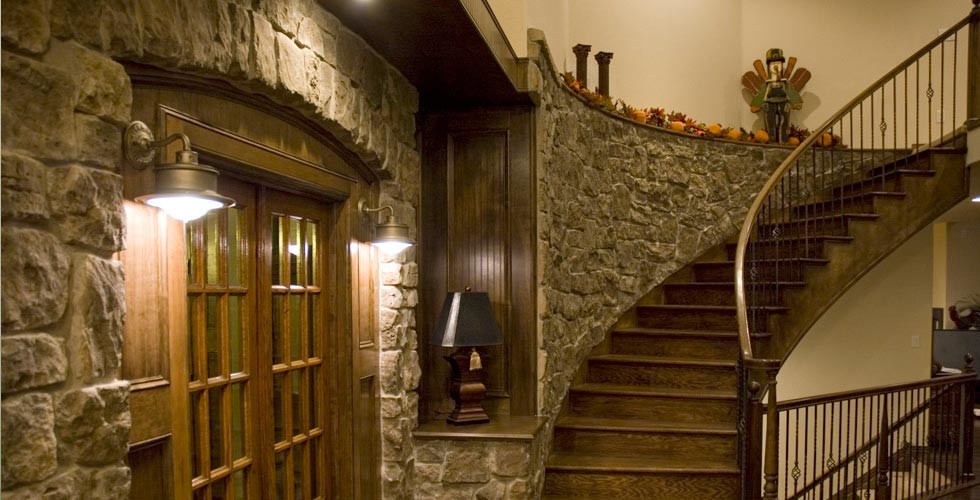 Medium sized rustic wood curved staircase in Denver with wood risers.