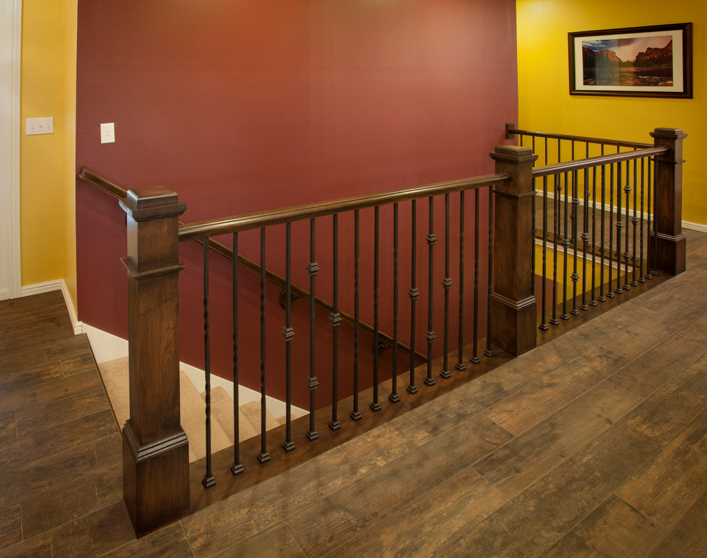 This is an example of a medium sized traditional carpeted straight mixed railing staircase in Other with carpeted risers.