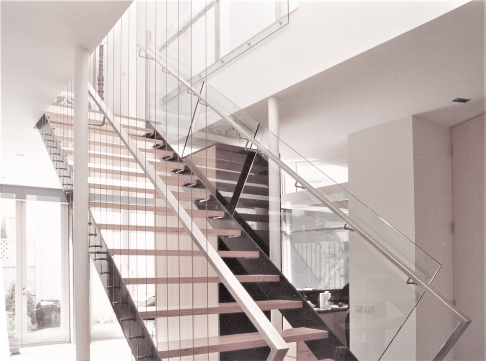 Inspiration for a mid-sized contemporary wooden straight open and mixed material railing staircase remodel in Melbourne