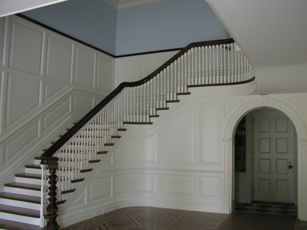 Classic wood staircase in New York with wood risers.