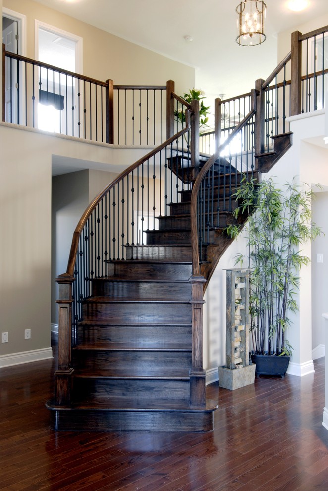 Inspiration for a medium sized classic wood curved mixed railing staircase in New York with wood risers.
