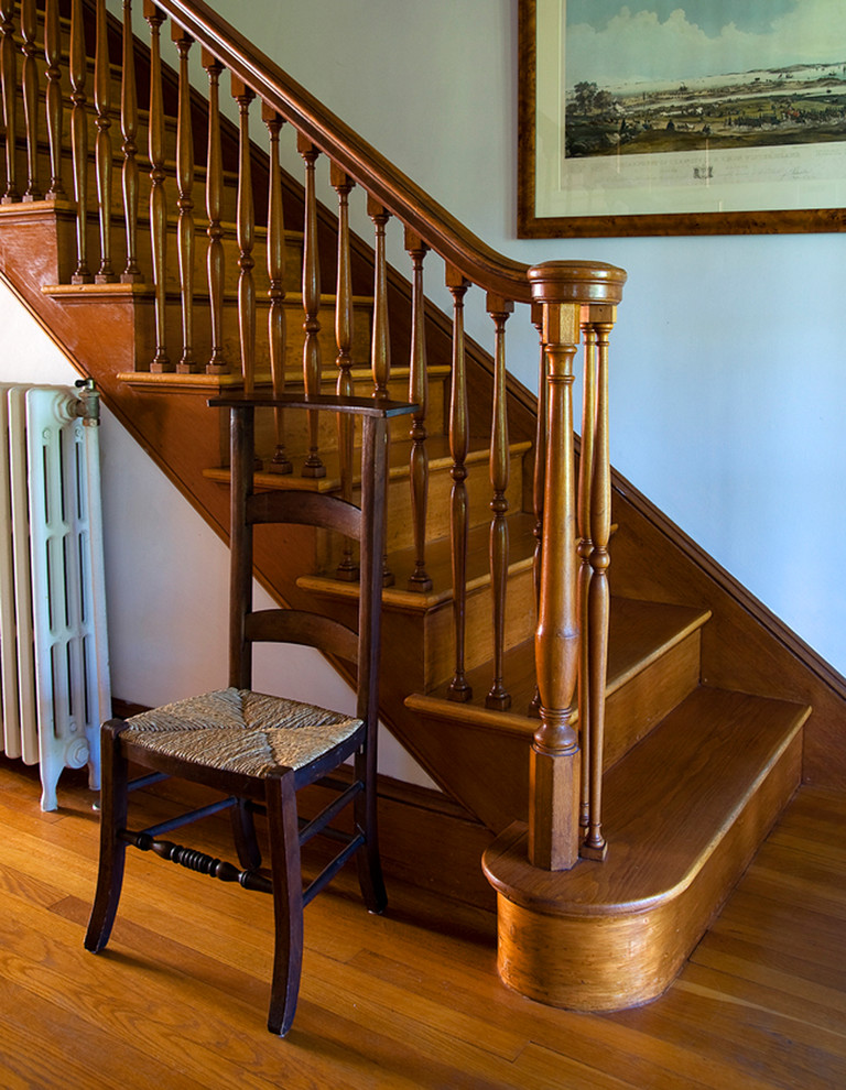 This is an example of a classic wood staircase in Boston with wood risers.