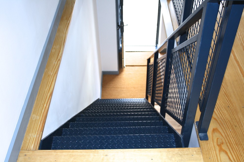 Design ideas for a medium sized urban metal straight staircase in Kent with open risers.