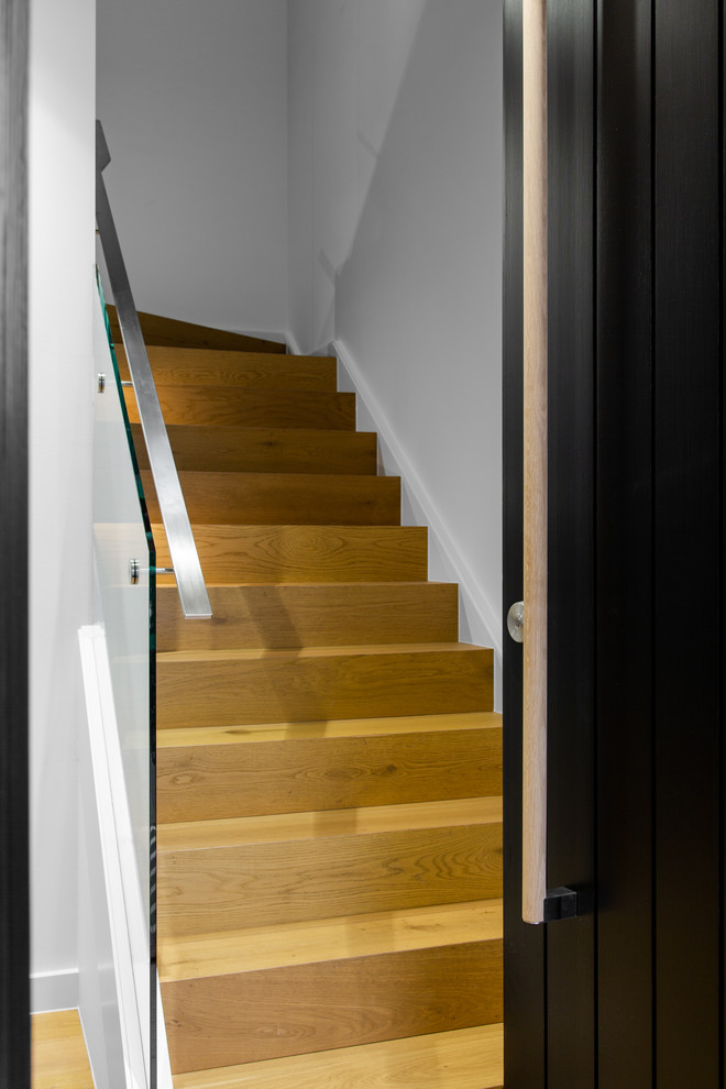 Design ideas for a medium sized contemporary wood l-shaped glass railing staircase in Adelaide with wood risers.