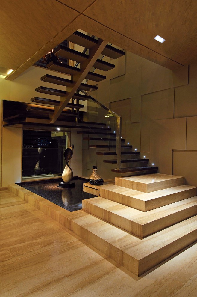 Inspiration pour un escalier flottant design de taille moyenne avec des marches en bois.