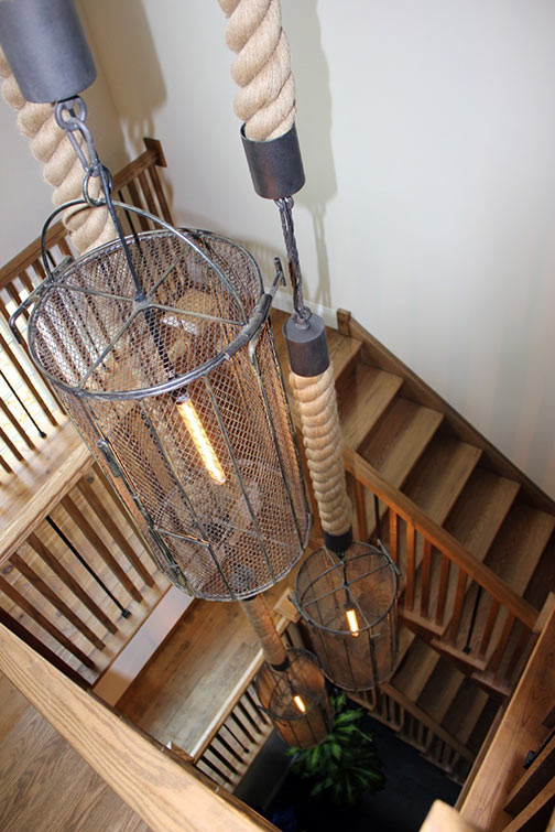 This is an example of an expansive bohemian wood spiral staircase in Boston with wood risers.