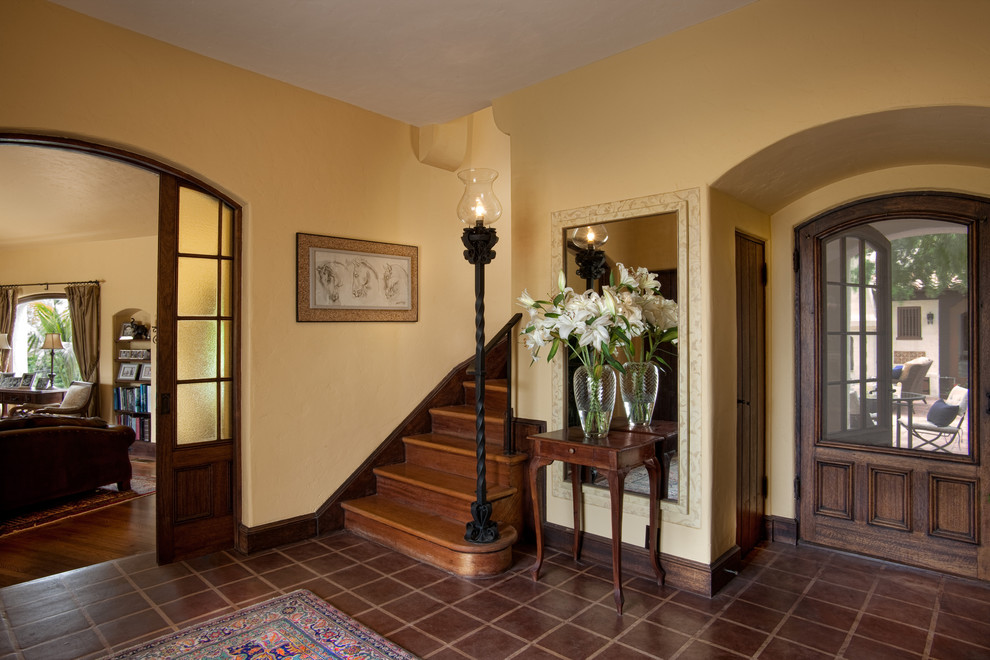Example of a tuscan wooden straight staircase design in San Diego with wooden risers