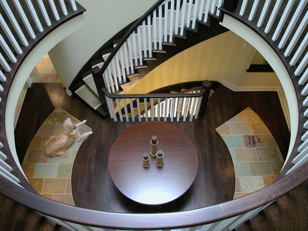 Inspiration for an eclectic wood staircase in Toronto with wood risers.