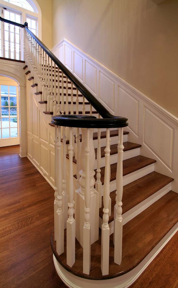 Photo of a traditional wood staircase in Seattle with painted wood risers.