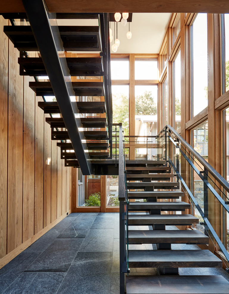 Inspiration for a contemporary floating mixed material railing staircase remodel in Richmond