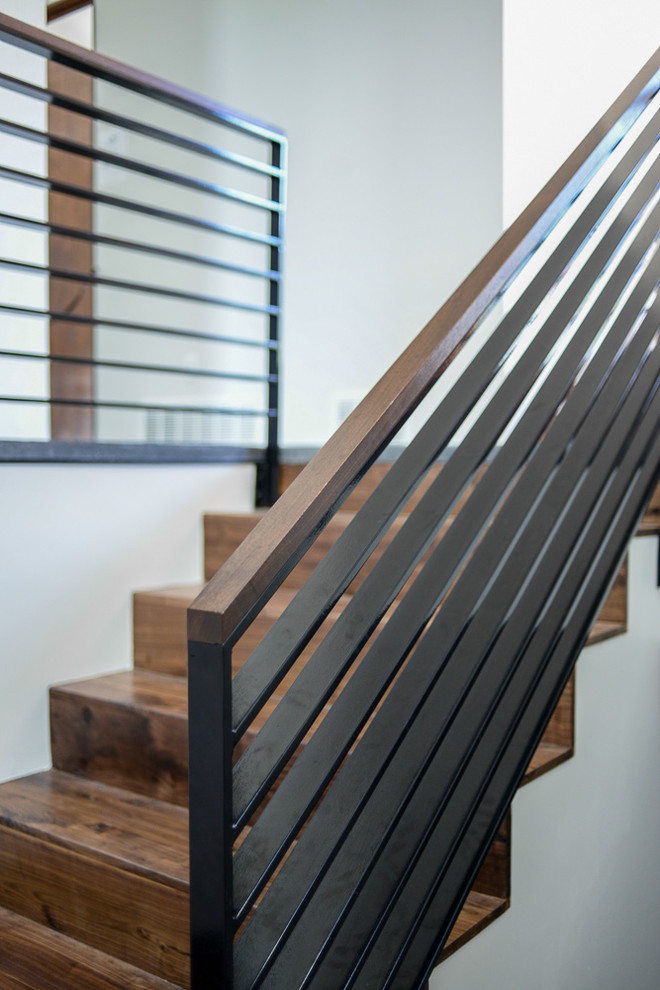 Staircase - mid-sized modern wooden u-shaped staircase idea in Salt Lake City with wooden risers