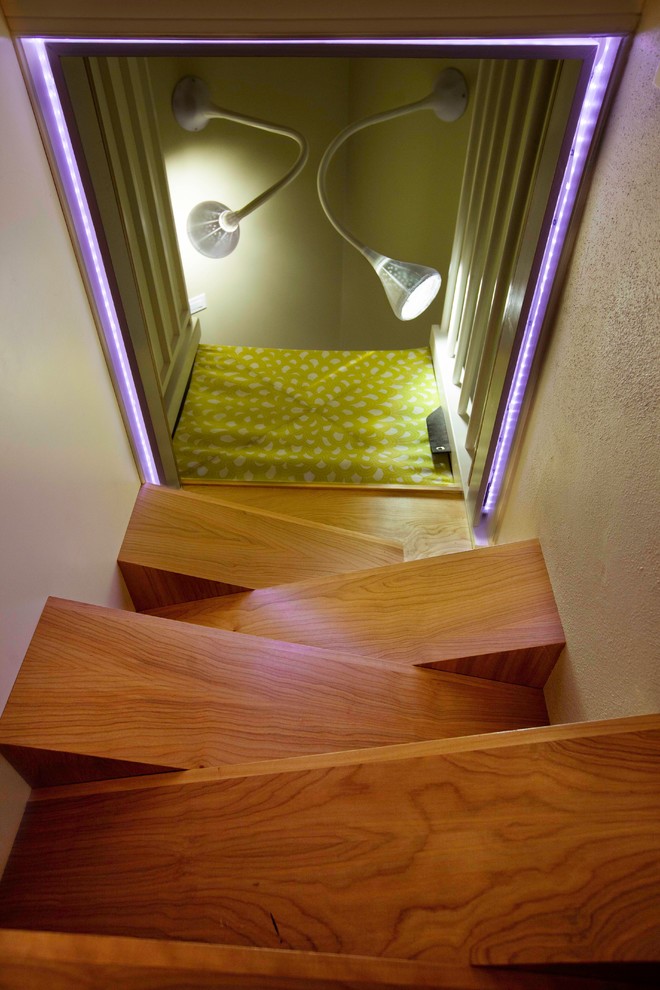 Design ideas for a contemporary staircase in Boston with feature lighting.