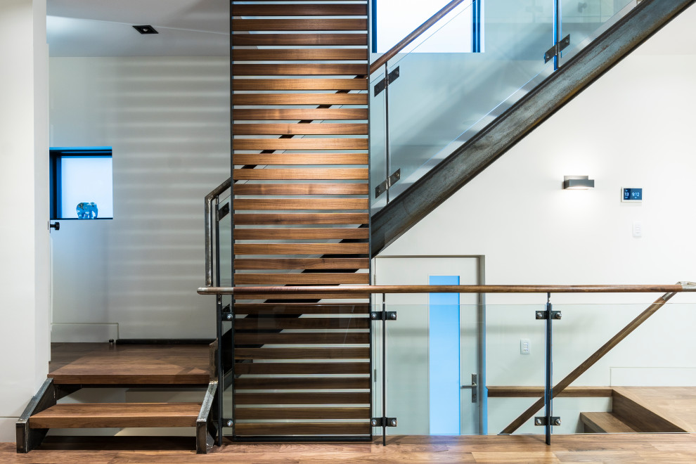 Staircase - large modern wooden u-shaped open and mixed material railing staircase idea in Toronto