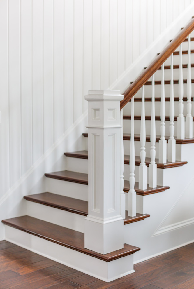 Medium sized nautical wood straight wood railing staircase in Jacksonville with painted wood risers.